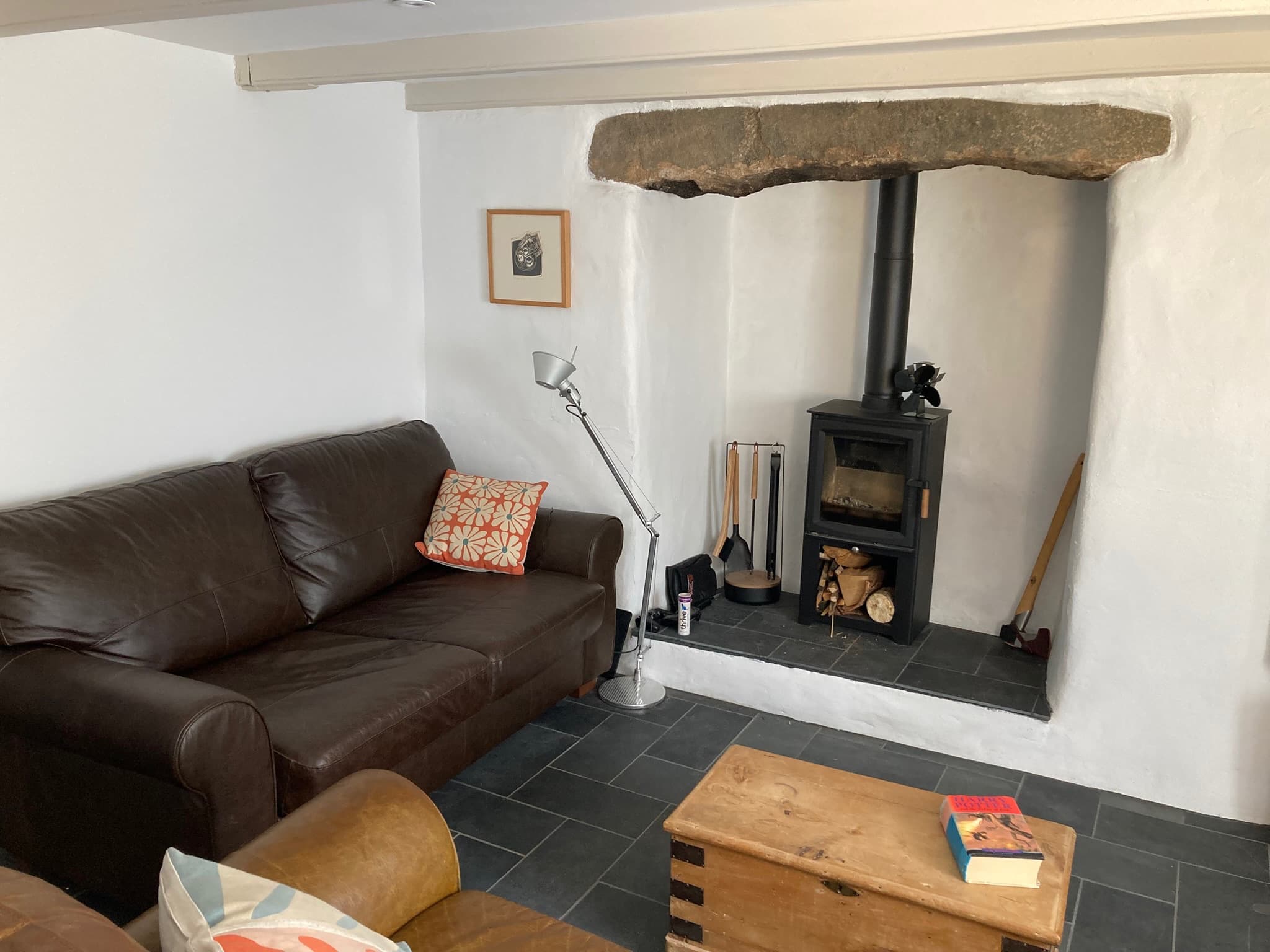Inglenook fireplace with wood burner and comfy sofas
